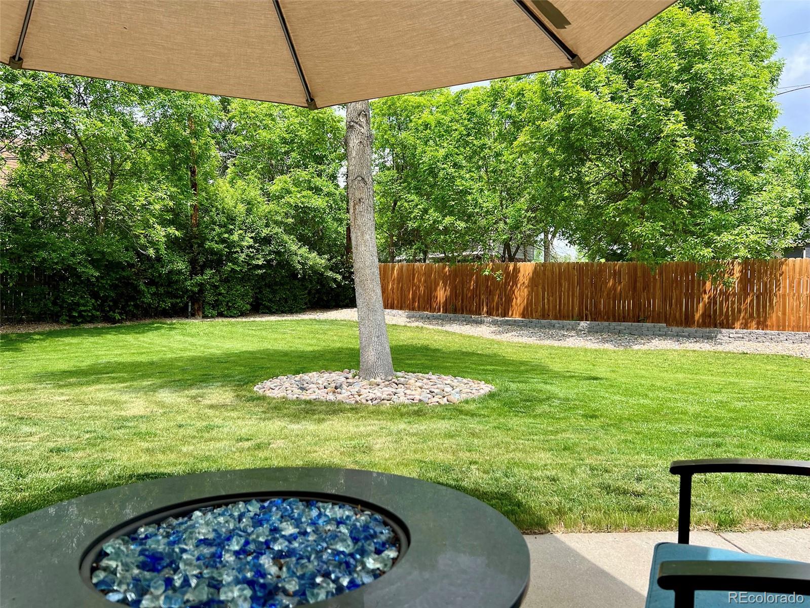 5389 West Roxbury Place Littleton, CO 80128 - Photo 30 of 31 a view of a backyard with a garden and plants