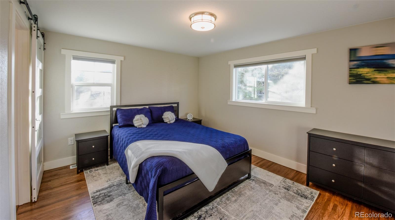 5389 West Roxbury Place Littleton, CO 80128 - Photo 9 of 31 a bedroom with a bed and a window