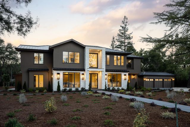 a front view of a residential apartment building with a yard