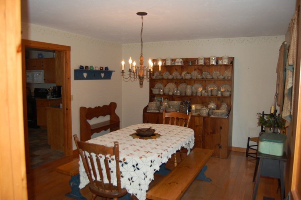 215 Crouch Road Warren, MA 01092 - Photo 12 of 33 a bedroom with a bed a lamp and potted plant