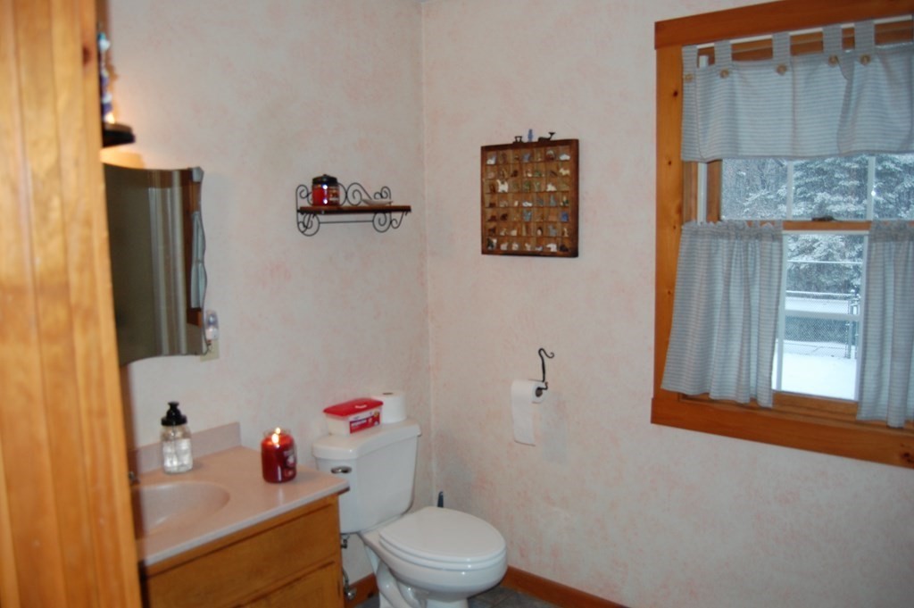 215 Crouch Road Warren, MA 01092 - Photo 24 of 33 a white toilet sitting next to a bathroom sink