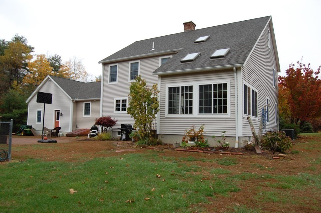 215 Crouch Road Warren, MA 01092 - Photo 3 of 33 a front view of a house with a yard