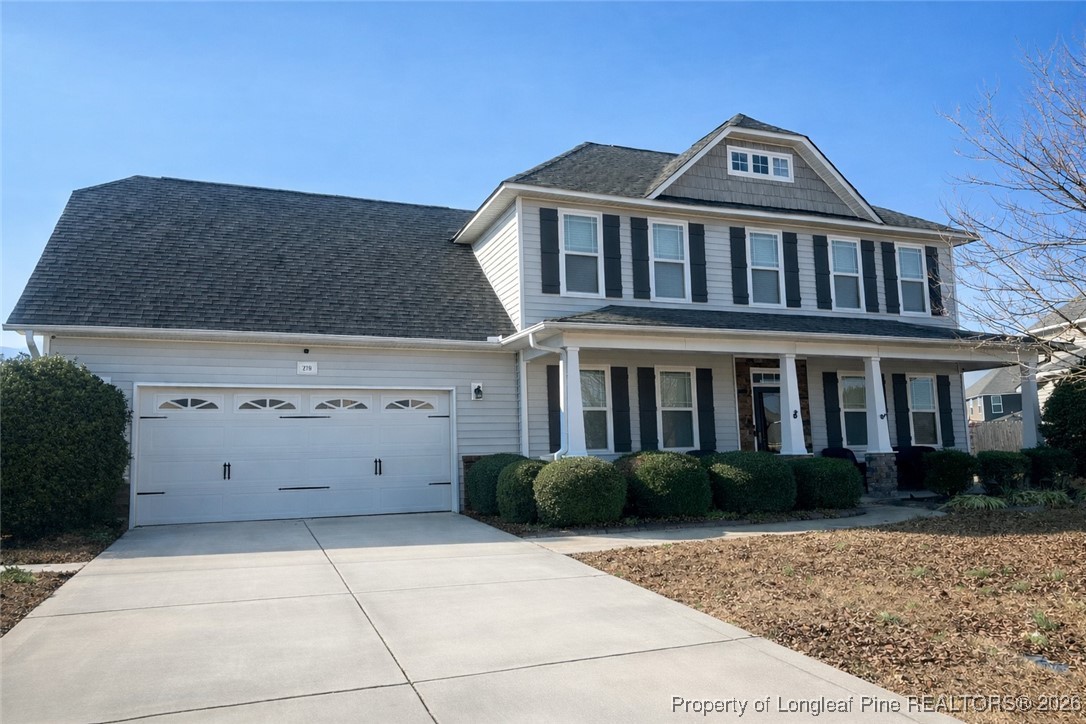 278 Exeter Drive Raeford, NC 28376 - Photo 1 of 3 a front view of a house with a garden
