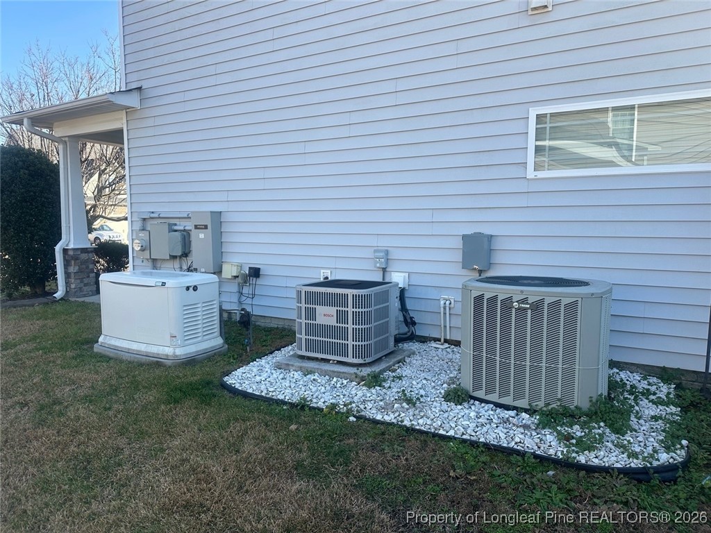 278 Exeter Drive Raeford, NC 28376 - Photo 3 of 3 a view of a chairs and table in backyard of the house