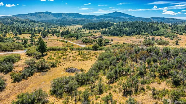 a view of a town with mountains in the background
