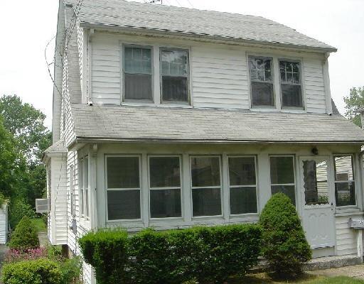 126 Belltown Road Stamford, CT 06905 - Photo 1 of 1 a view of a brick house with large windows