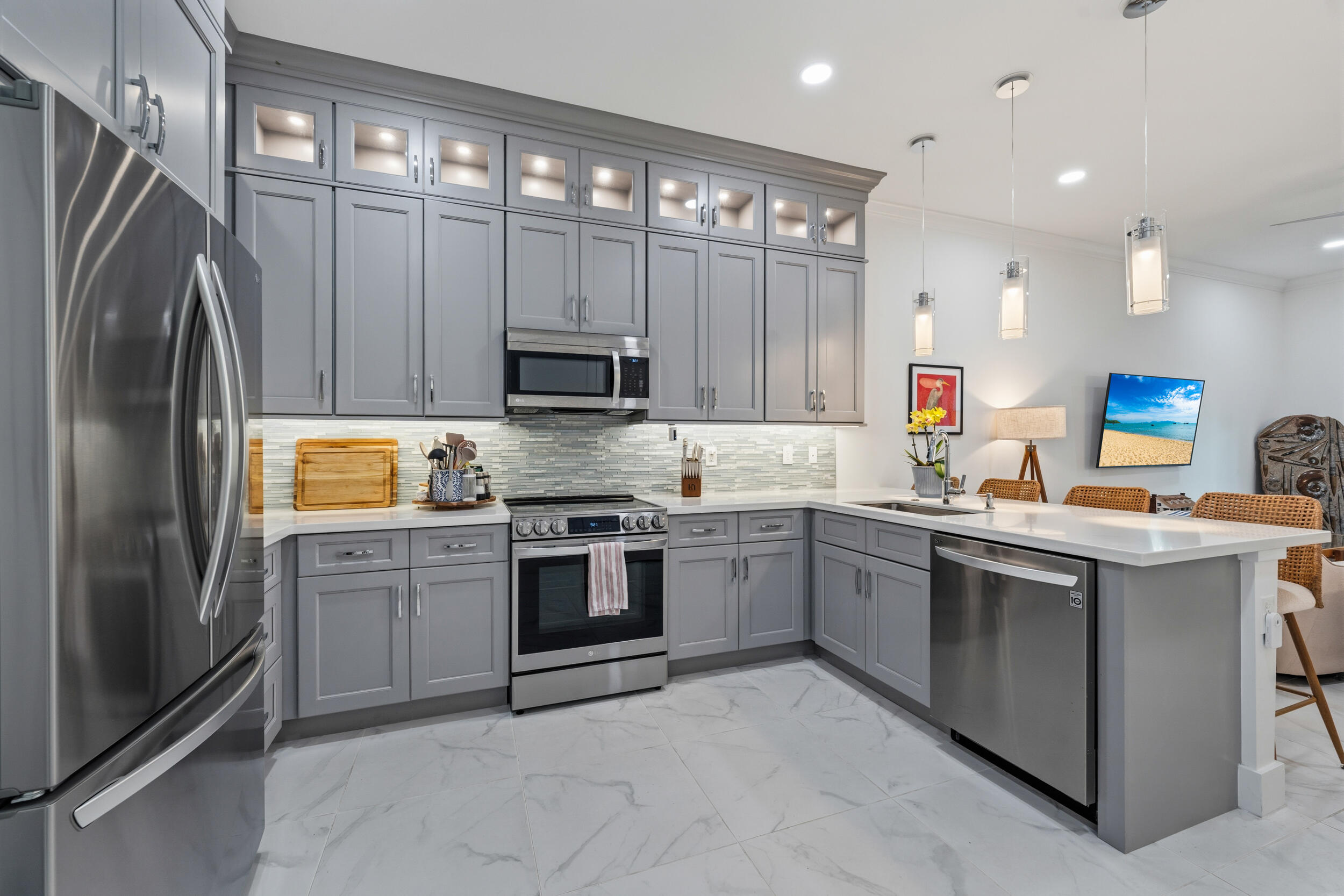 a kitchen with a sink stainless steel appliances and cabinets