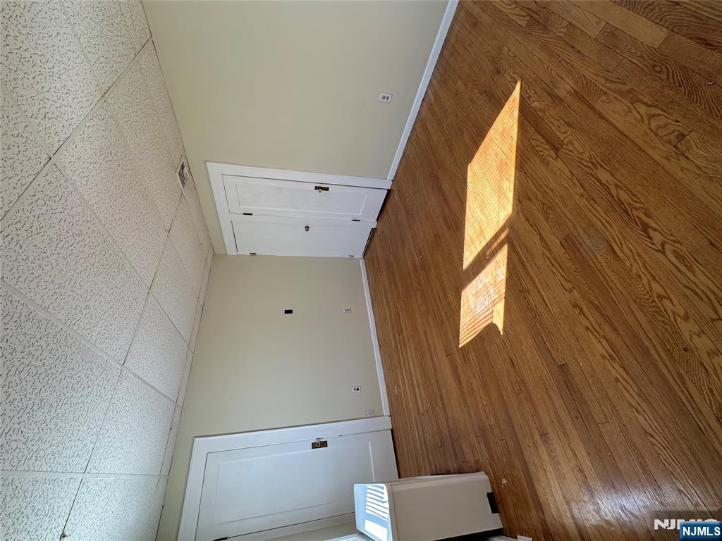 622-624 8th Street, Unit 2L Lyndhurst, NJ 07071 - Photo 14 of 23 a view of a room with wooden floor and white walls