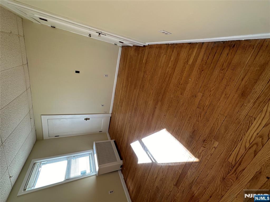 622-624 8th Street, Unit 2L Lyndhurst, NJ 07071 - Photo 15 of 23 a view of an empty room with wooden floor and a window