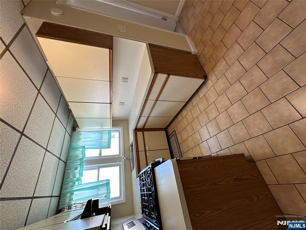 622-624 8th Street, Unit 2L Lyndhurst, NJ 07071 - Photo 17 of 23 a kitchen with stainless steel appliances a sink and cabinets