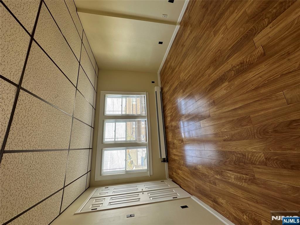 622-624 8th Street, Unit 2L Lyndhurst, NJ 07071 - Photo 2 of 23 an empty room with wooden floor and windows