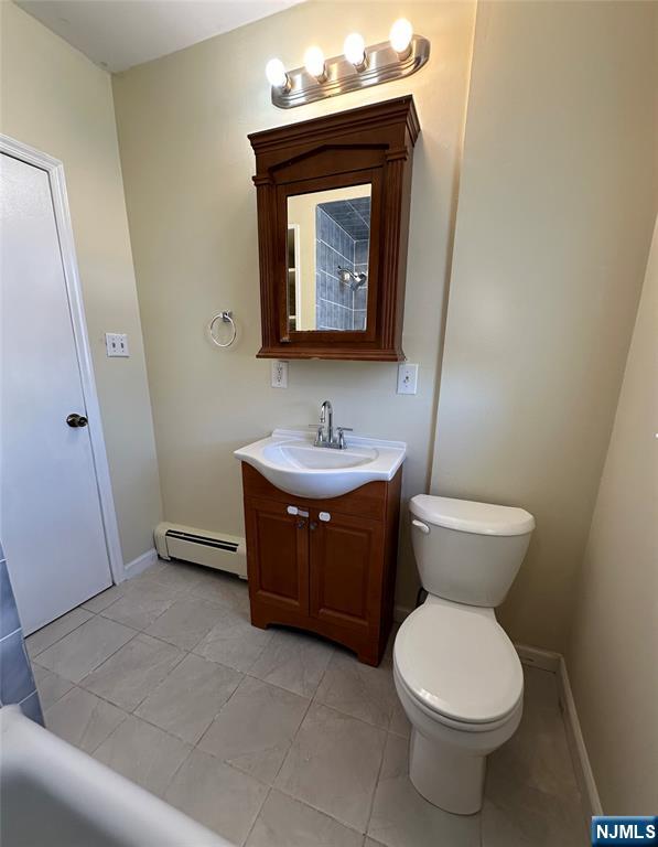 622-624 8th Street, Unit 2L Lyndhurst, NJ 07071 - Photo 21 of 23 a bathroom with a toilet sink and mirror