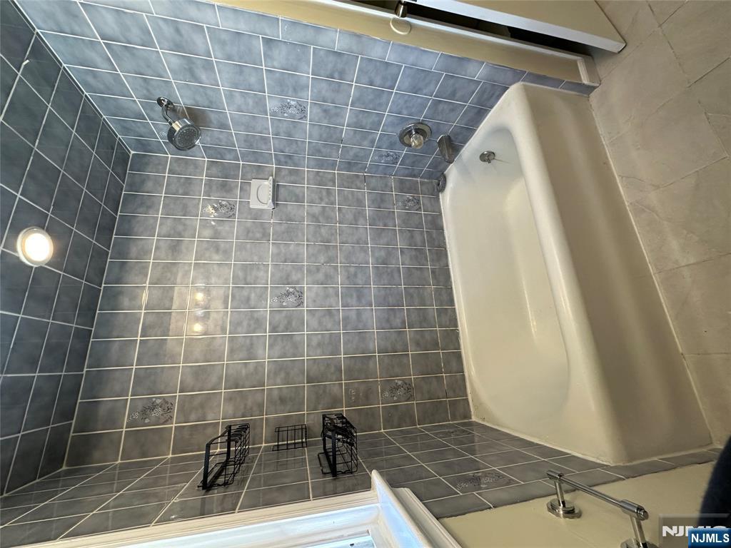 622-624 8th Street, Unit 2L Lyndhurst, NJ 07071 - Photo 22 of 23 a white bath tub sitting next to a shower