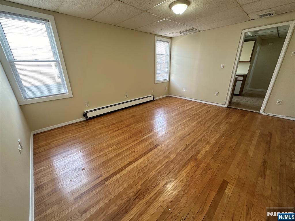 622-624 8th Street, Unit 2L Lyndhurst, NJ 07071 - Photo 8 of 23 an empty room with wooden floor and windows
