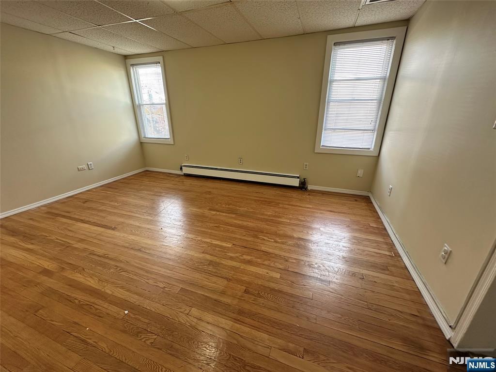622-624 8th Street, Unit 2L Lyndhurst, NJ 07071 - Photo 9 of 23 an empty room with wooden floor and windows