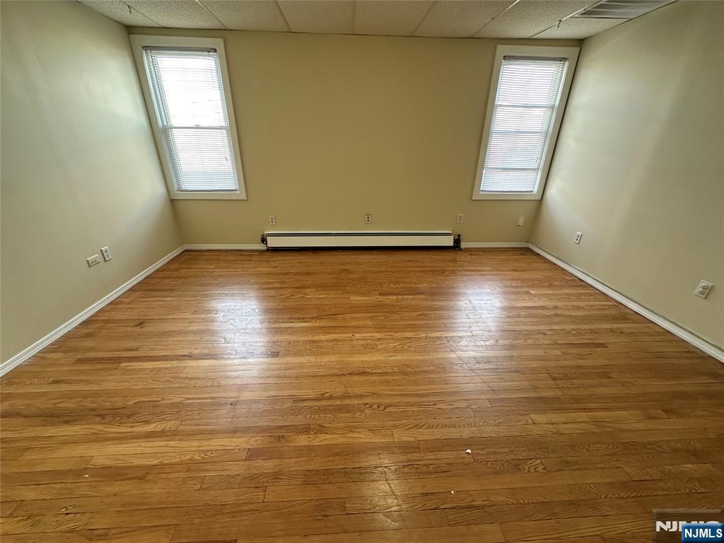 622-624 8th Street, Unit 2L Lyndhurst, NJ 07071 - Photo 10 of 23 wooden floor in an empty room with a window