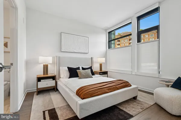 a bedroom with a bed and a couch