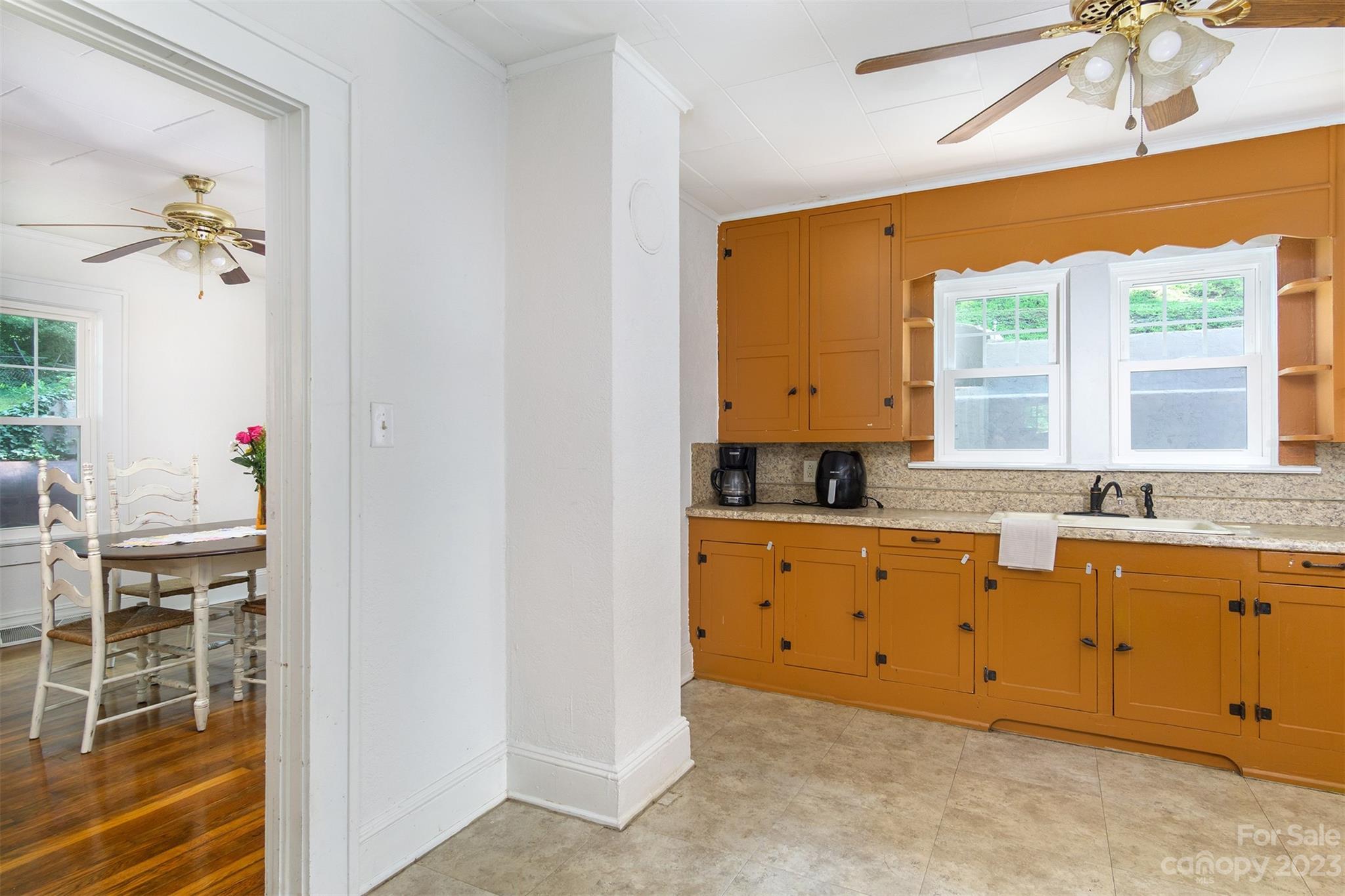 404 Huffman Street Morganton, NC 28655 - Photo 18 of 27 a kitchen with granite countertop a sink cabinets and window