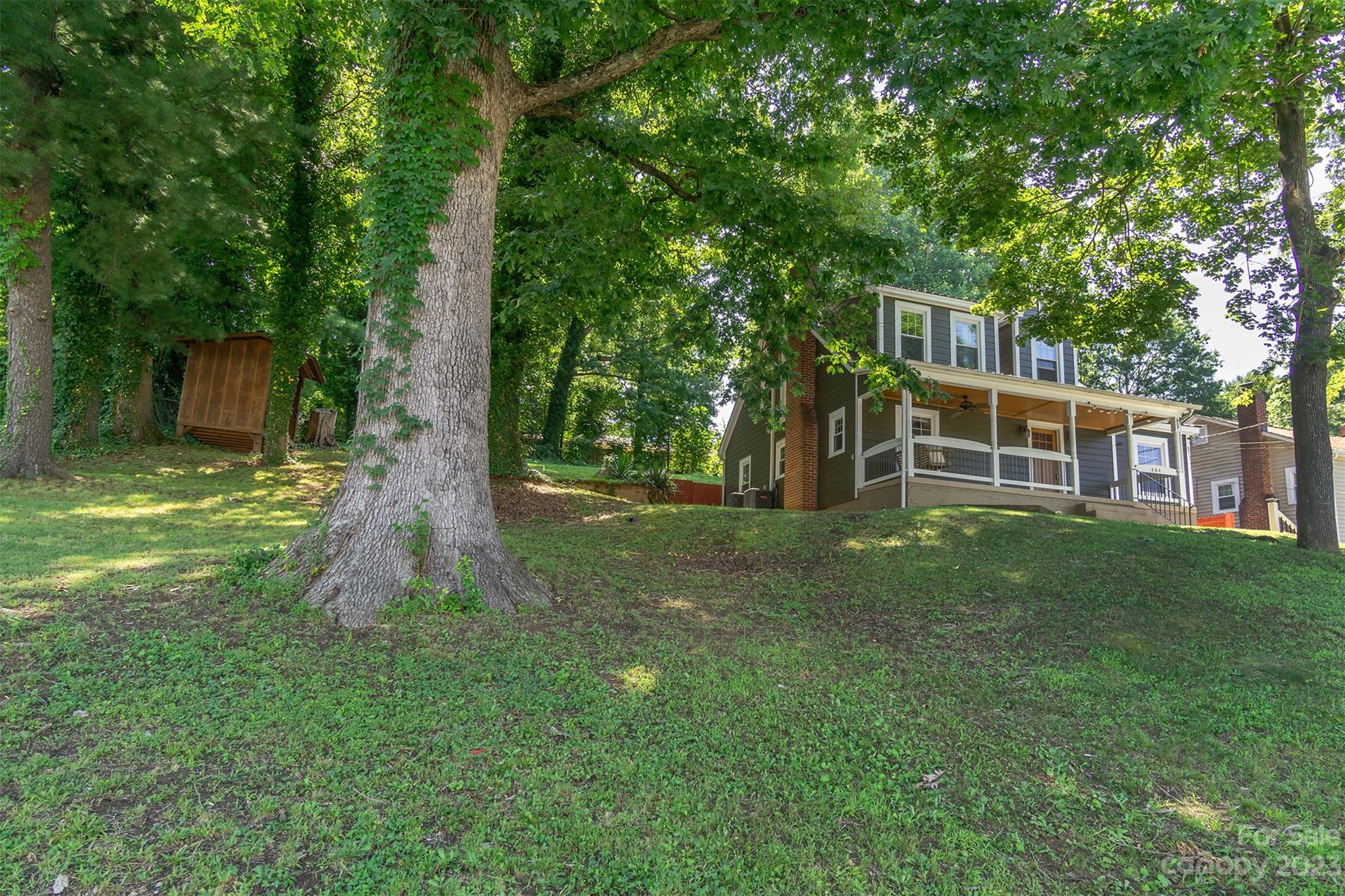404 Huffman Street Morganton, NC 28655 - Photo 27 of 27 a view of a house with backyard and a tree