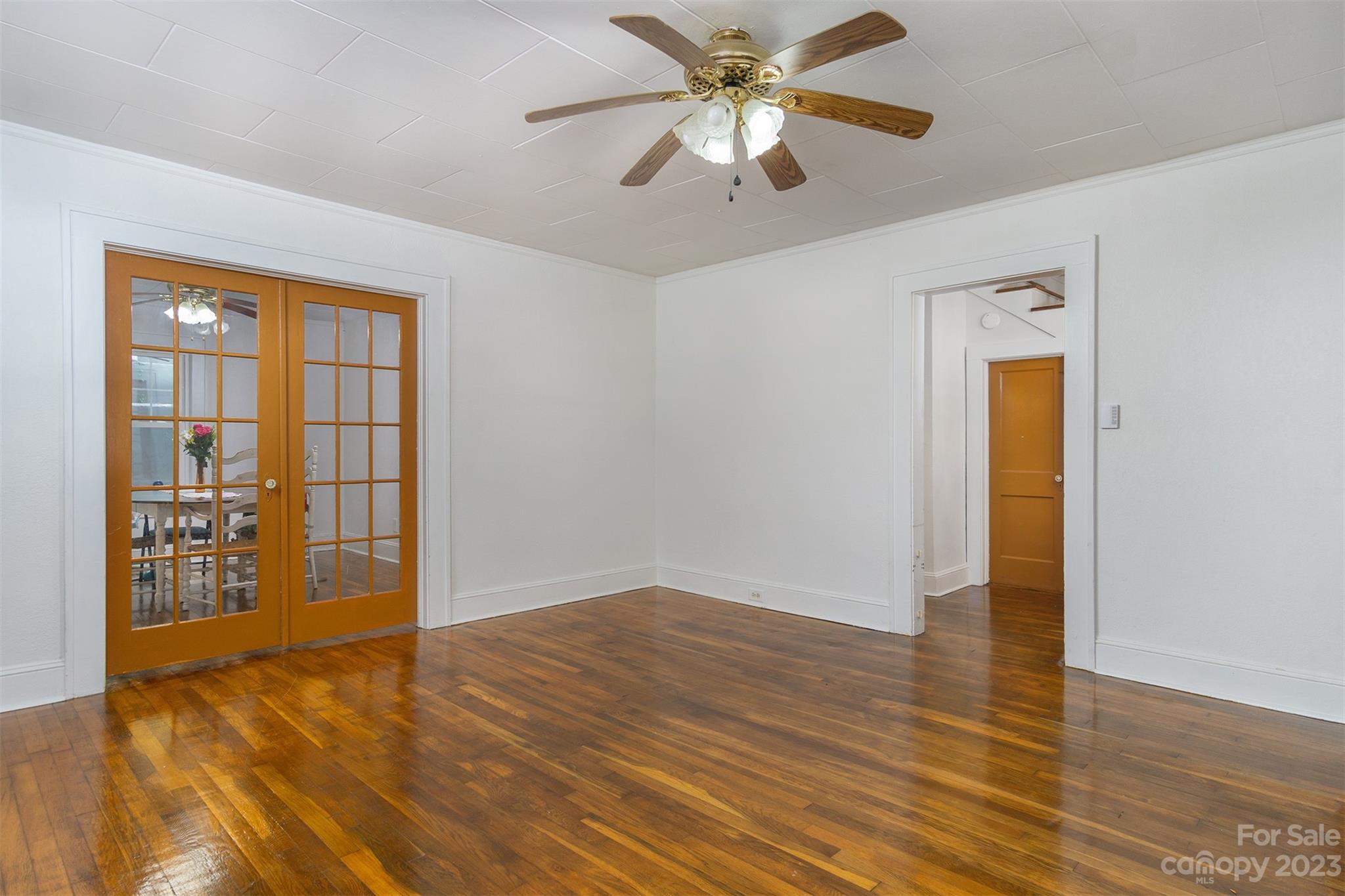 404 Huffman Street Morganton, NC 28655 - Photo 10 of 27 an empty room with wooden floor closet and windows