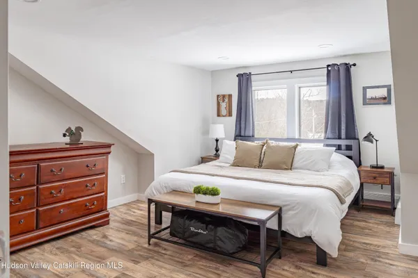 a bed room with a bed and a dresser