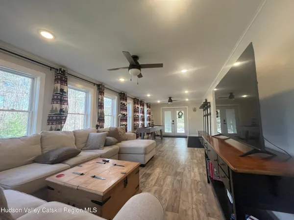 a living room with furniture and a large window