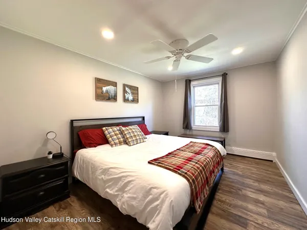 a bedroom with a large bed and a window