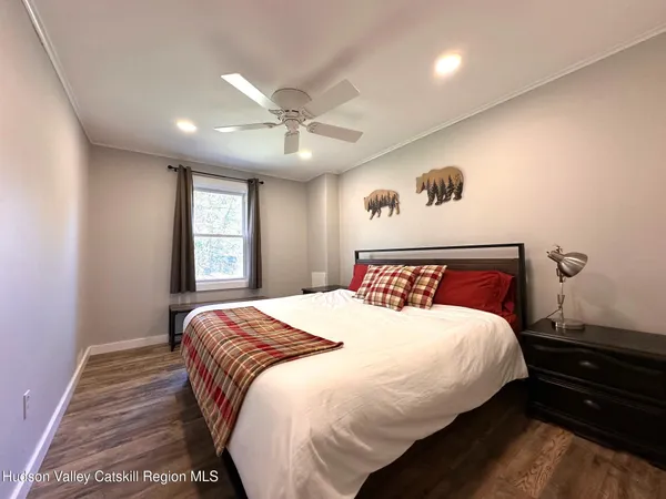 a bedroom with a large bed and a window