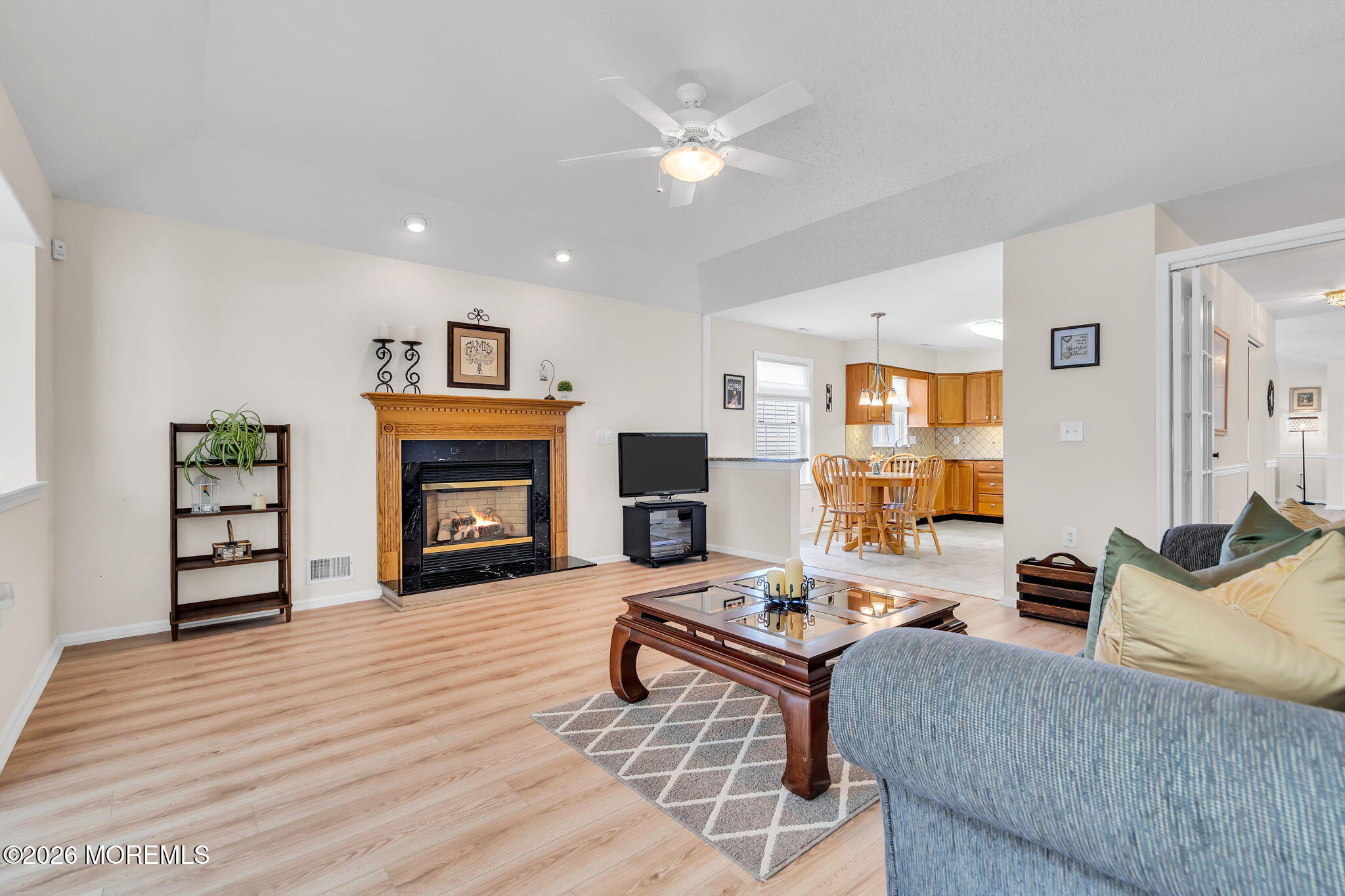 10 Congressional Road Jackson, NJ 08527 - Photo 29 of 72 a living room with furniture and a fireplace
