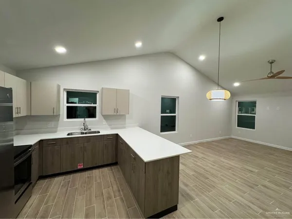 a large kitchen with stainless steel appliances kitchen island a large island in the center