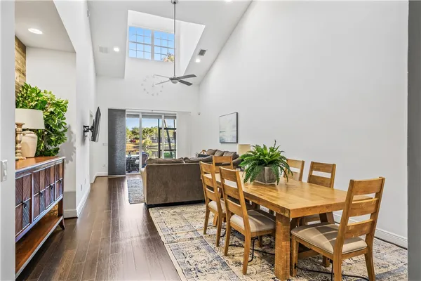 a dining room with furniture and wooden floor