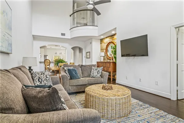 a living room with fireplace furniture and a flat screen tv