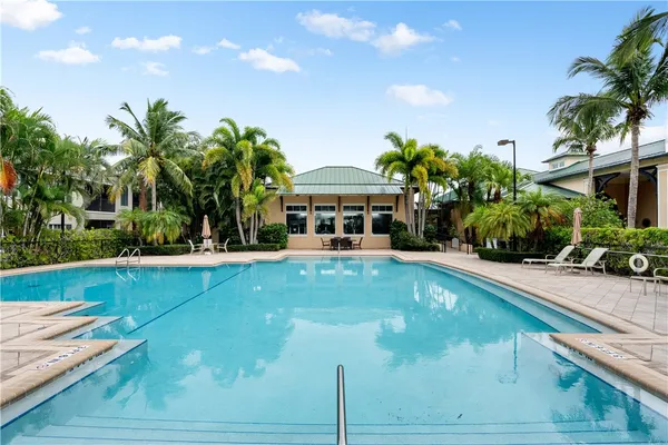 a front view of house with yard and outdoor seating
