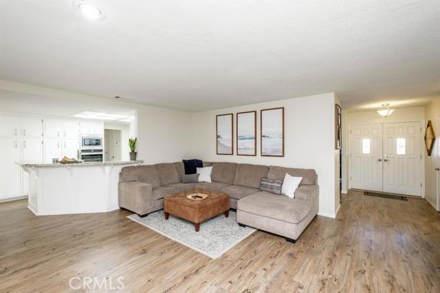 15222 Riverside Drive Apple Valley, CA 92307 - Photo 12 of 43 a living room with furniture and a wooden floor