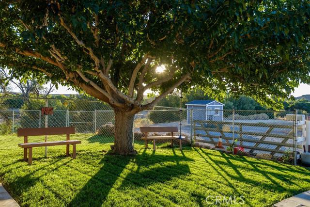 15222 Riverside Drive Apple Valley, CA 92307 - Photo 25 of 43 a view of a bench in a backyard