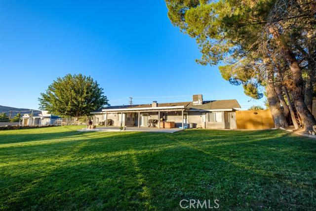 15222 Riverside Drive Apple Valley, CA 92307 - Photo 29 of 43 a view of a house with a big yard