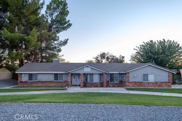 15222 Riverside Drive Apple Valley, CA 92307 - Photo 41 of 43 a front view of a house with garden