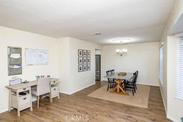 15222 Riverside Drive Apple Valley, CA 92307 - Photo 5 of 43 a view of a dining room with furniture and chandelier