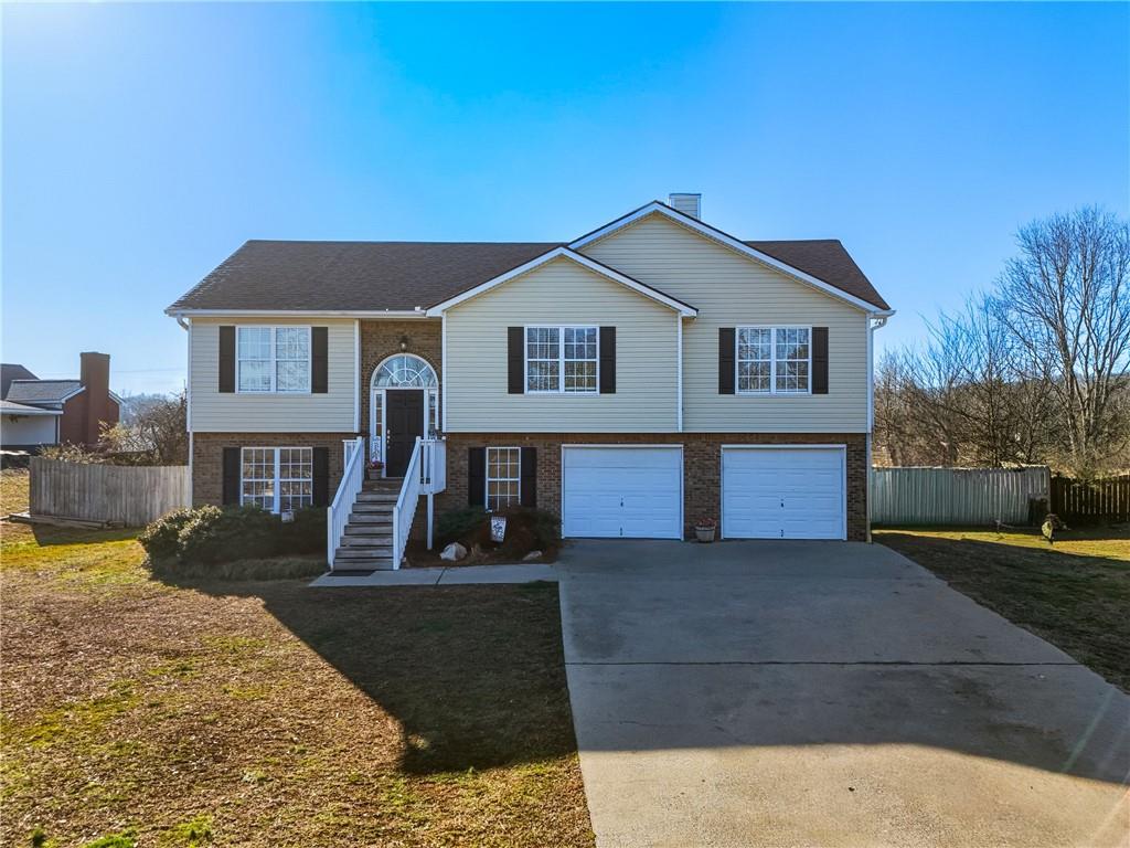 59 Tatum Ridge Road Southwest Cartersville, GA 30120 - Photo 1 of 1 a front view of a house with yard