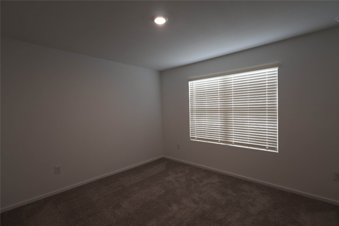15357 Dapple Blf Lane Conroe, TX 77302 - Photo 12 of 17 a view of an empty room with a window