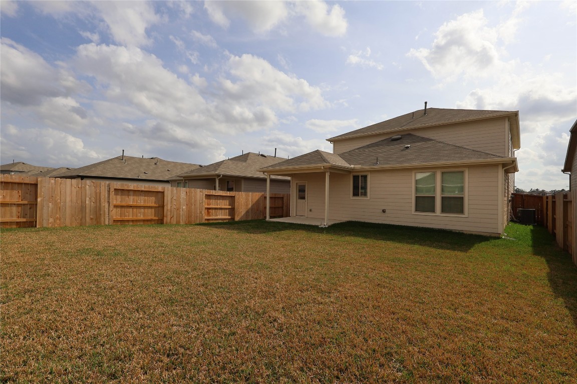 15357 Dapple Blf Lane Conroe, TX 77302 - Photo 16 of 17 front view of a house with a yard