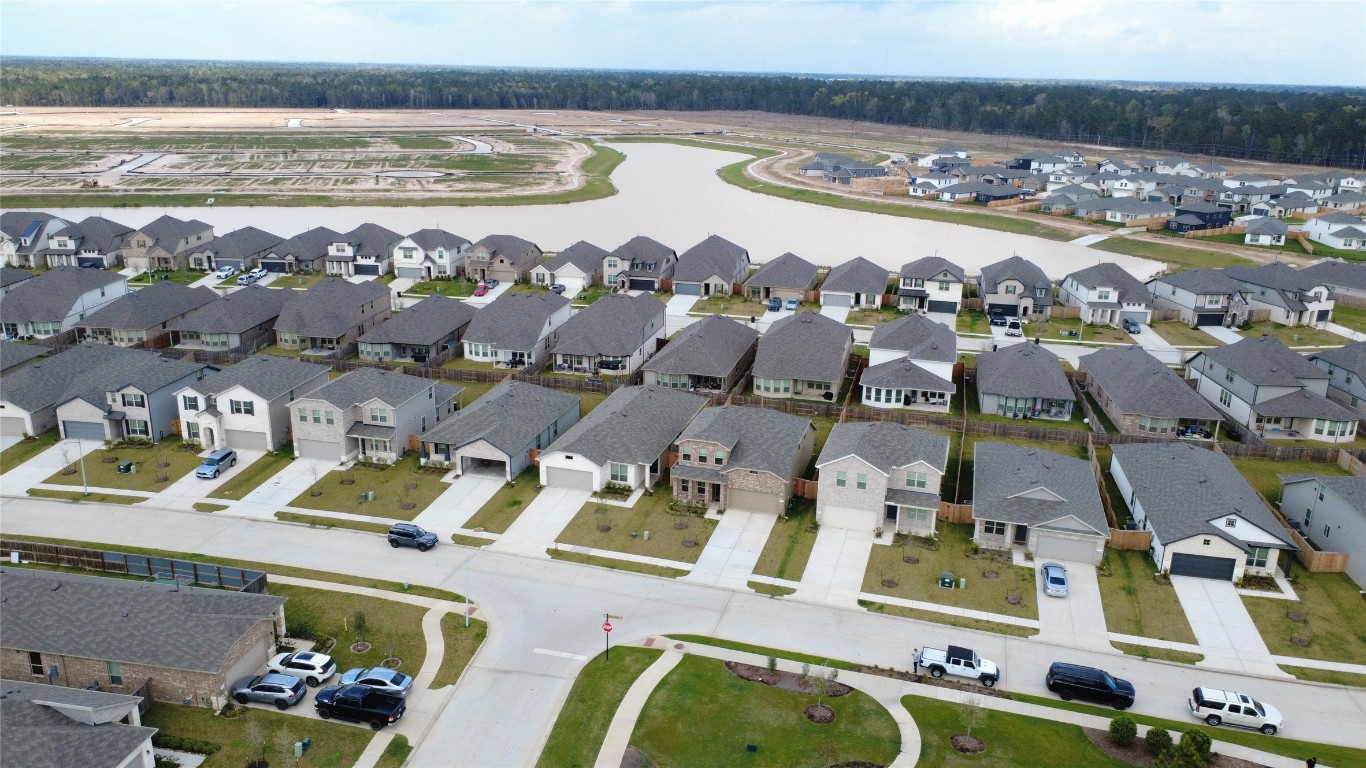 15357 Dapple Blf Lane Conroe, TX 77302 - Photo 3 of 17 an aerial view of residential houses with outdoor space