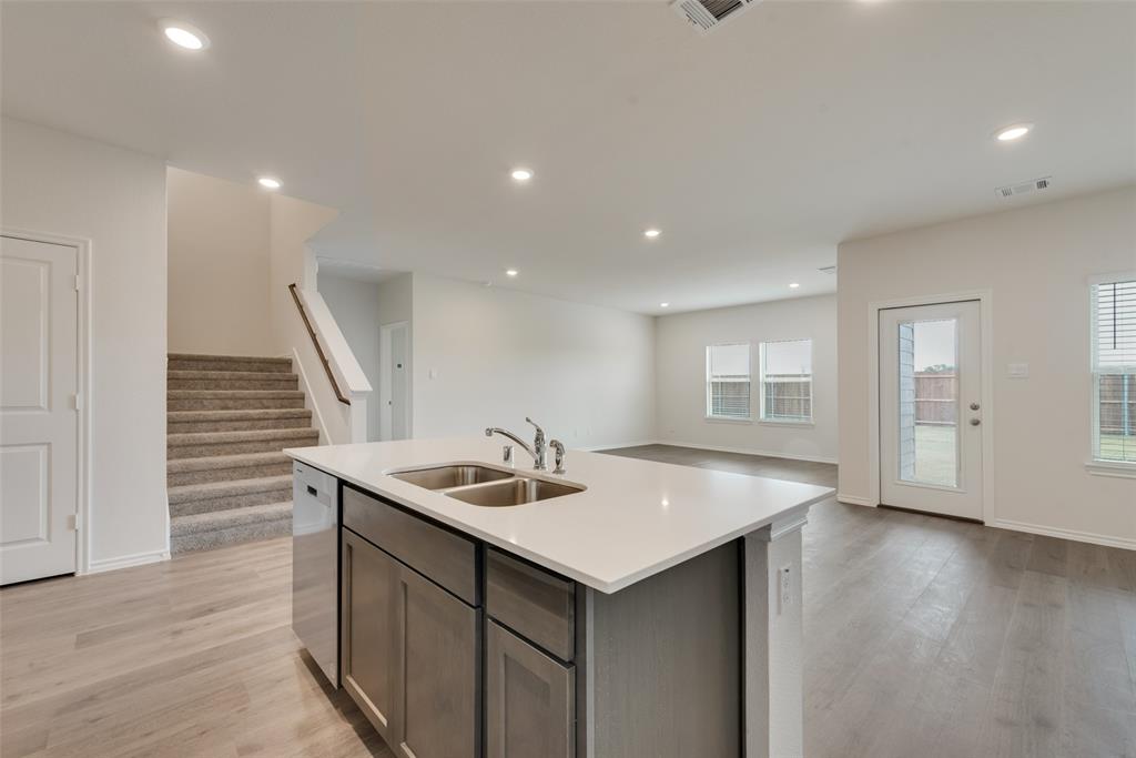 1428 Millstead Rill Drive Caddo Mills, TX 75135 - Photo 6 of 24 a kitchen with sink and mirror