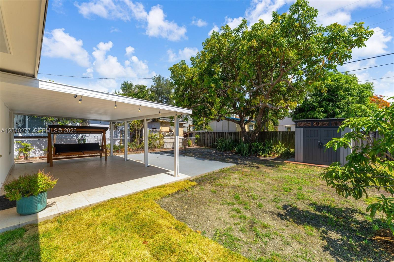 2131 Southwest 17th Street Miami, FL 33145 - Photo 25 of 28 Covered patio + mature avocado tree