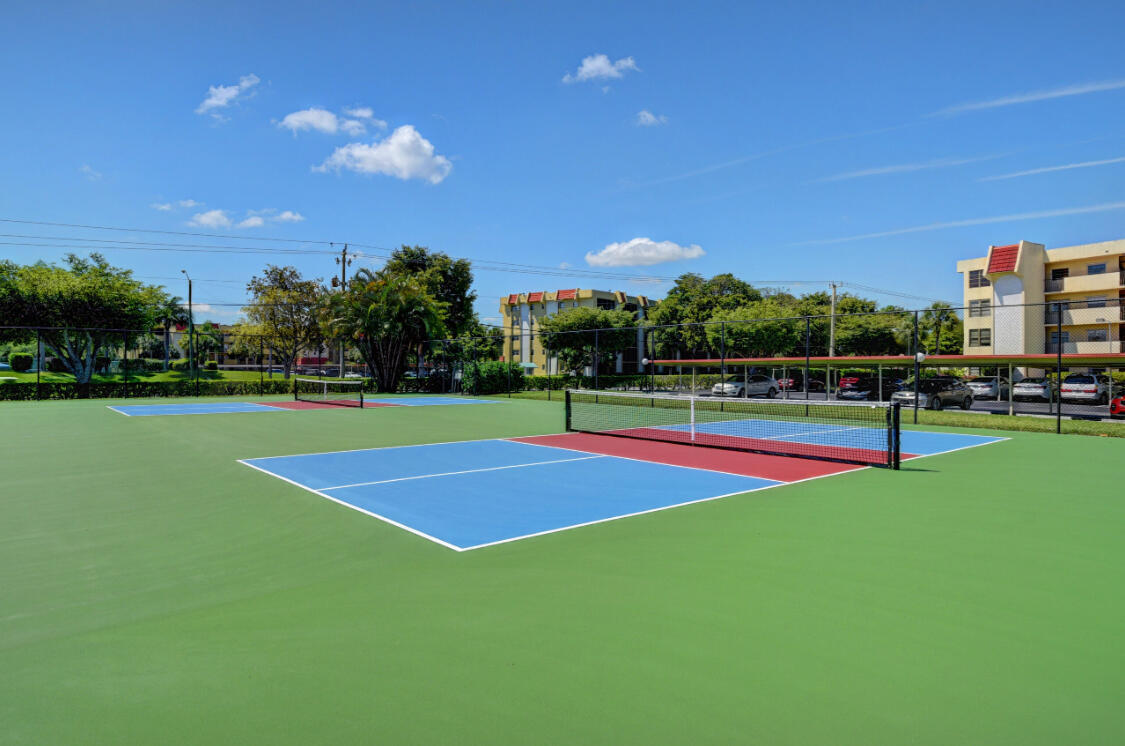 23249 Barwood Lane North, Unit 402 Boca Raton, FL 33428 - Photo 18 of 27 a view of tennis court