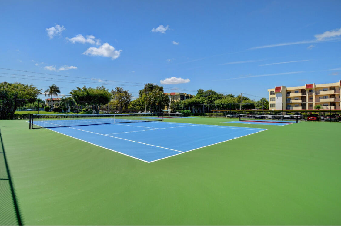 23249 Barwood Lane North, Unit 402 Boca Raton, FL 33428 - Photo 19 of 27 a view of a tennis court