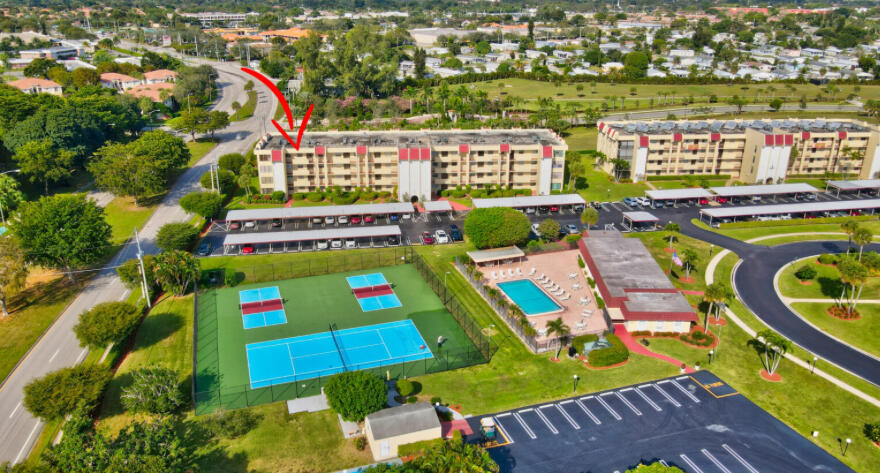 23249 Barwood Lane North, Unit 402 Boca Raton, FL 33428 - Photo 23 of 27 a view of swimming pool with outdoor seating and plants