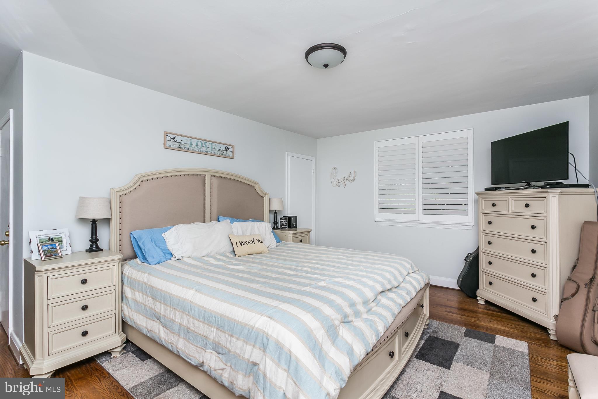 13902 Baldwin Mill Road Baldwin, MD 21013 - Photo 21 of 30 a bedroom with a bed and a flat screen tv