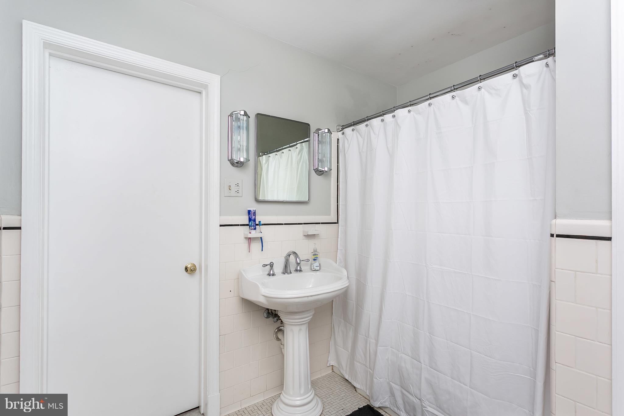 13902 Baldwin Mill Road Baldwin, MD 21013 - Photo 24 of 30 a bathroom with a sink and a mirror