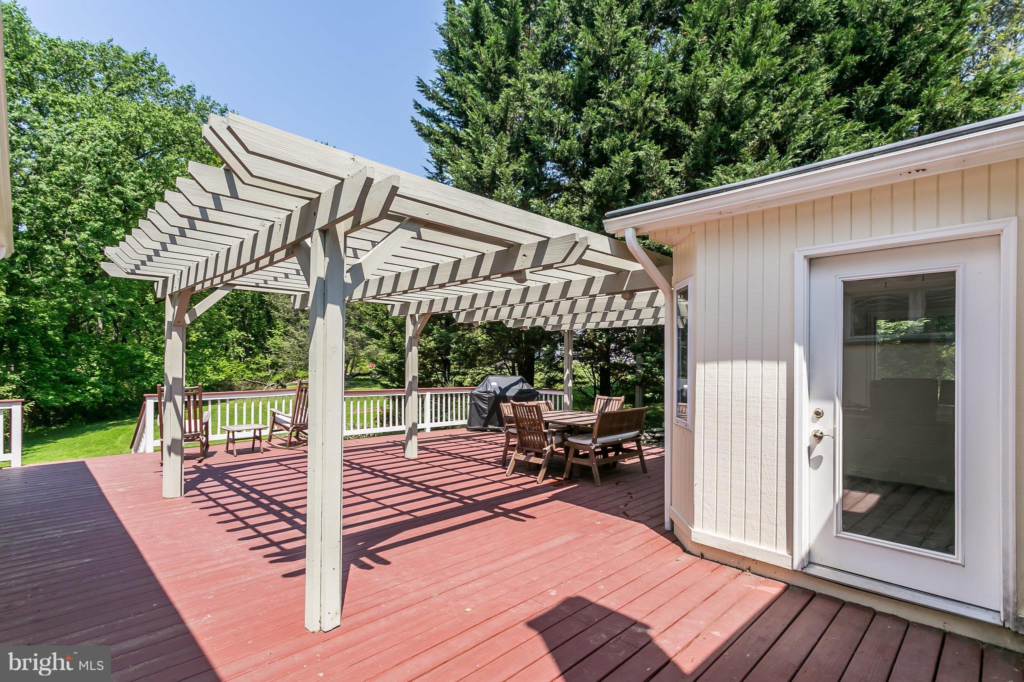 13902 Baldwin Mill Road Baldwin, MD 21013 - Photo 25 of 30 a patio with yard glass top table and chairs